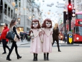 EDITORIAL USE ONLY:  Two life-size Victorian style dolls shocked Londoners this morning as the creepy pair popped up at commuter hotspots across the capital to mark the launch of the world’s first psychological theme park ride created by Derren Brown, coming to Thorpe Park Resort in 2016. Matt Alexander/ PA Wire Photo  Issue date: Thursday December 3, 2015. The incredibly realistic 4ft 7” high ‘living dolls’ were played by two modelswho each spent over three hours being transformed by a top team of stylists, costume designers, make-up artists and dressers. The dolls were spotted at numerous venues in London including Charing Cross Tube Station, Oxford Street and Regent Street where they were seen carrying dolls and pushing an empty 1900’s style pram. Visitors to the ‘themed’ experience at Thorpe Park Resort in 2016 will embark on a 13 minute journey, making the one-of-a-kind attraction a totally unique theme park experience.